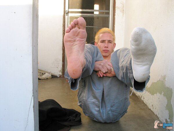 Mikko shows off his dirty socks and feet