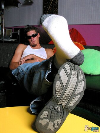 Evan Heinze shows off his socks and feet