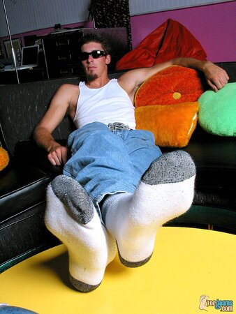 Evan Heinze shows off his socks and feet