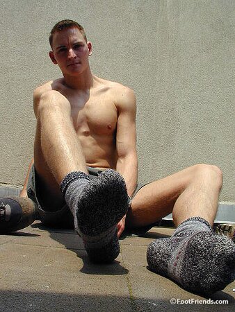 Mr. Gay London shows off his socks and feet