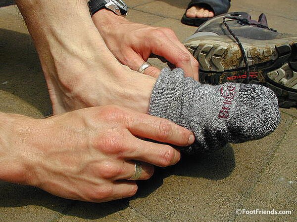 Mr. Gay London shows off his socks and feet