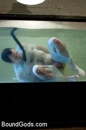 Bound in the sleepsack, submerged under water and made to cum