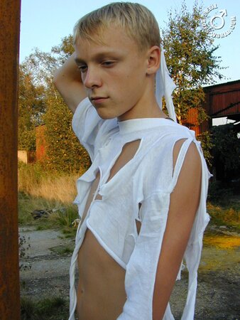 Kolja leaves just a ripped shirt on his body