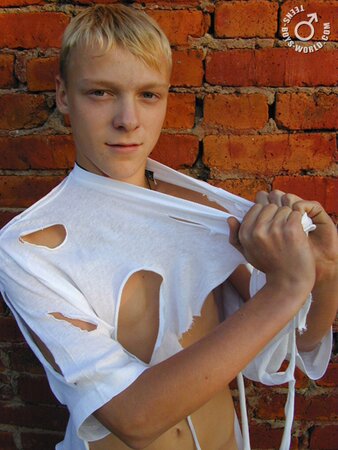 Kolja leaves just a ripped shirt on his body