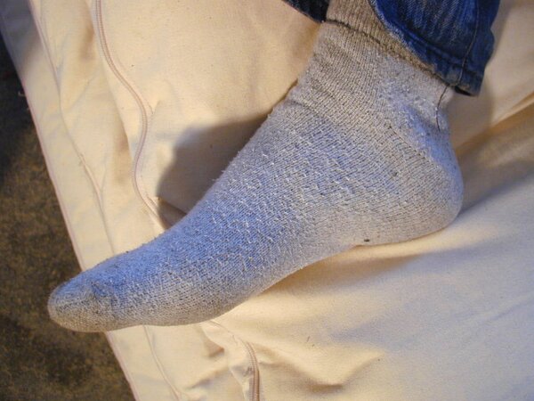 David teases with his smelly sport socks and playful feet