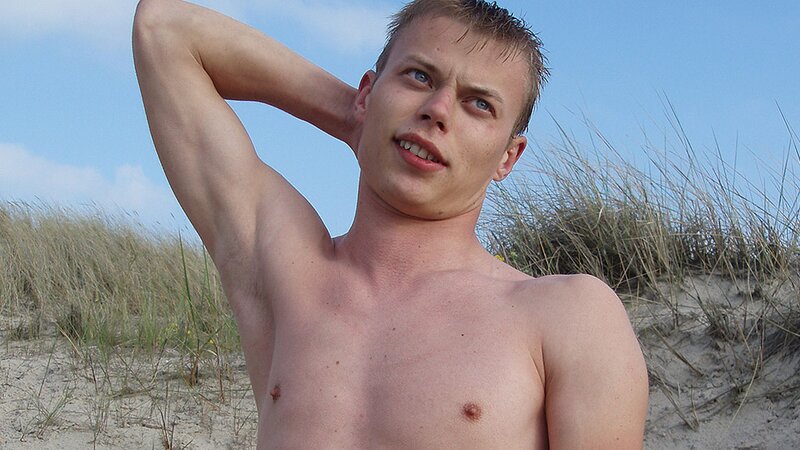 Smooth Euro twink Arnold pisses and cums at the beach