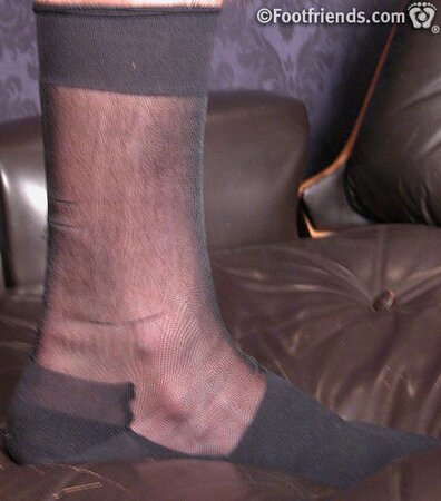 Jonathan shows off his business chic style with sheer socks and size 11 feet