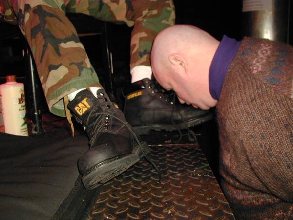 Men line up to worship Benjamin's boots and socks