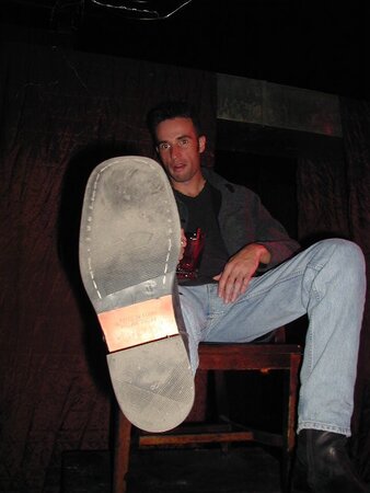 Michael shows off his stylish suit and reflexology socks at the party