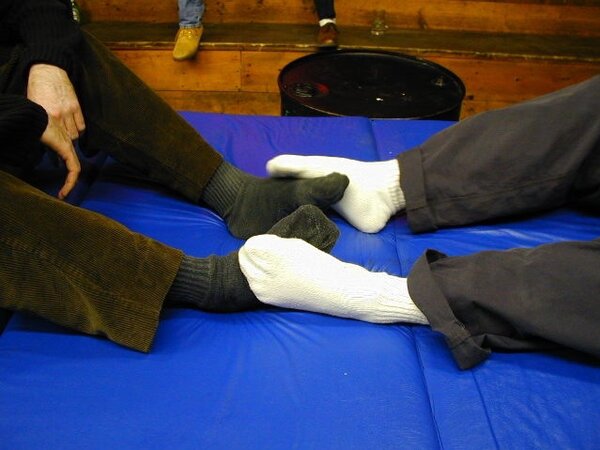 Michael shows off his stylish suit and reflexology socks at the party