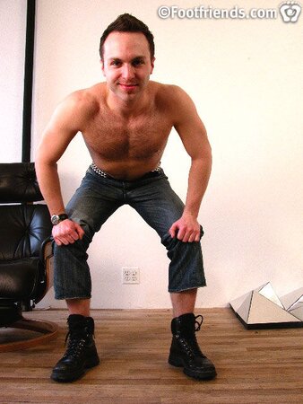 Tommy shows off his tough side in black contractor boots and a jock