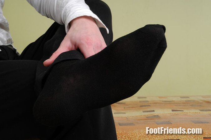 Tommy shows off his smooth young feet in black cotton socks