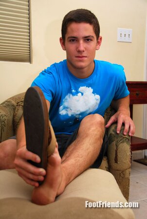 Cute 18-year-old Bradley shows off his dirty boy feet after removing his sandals